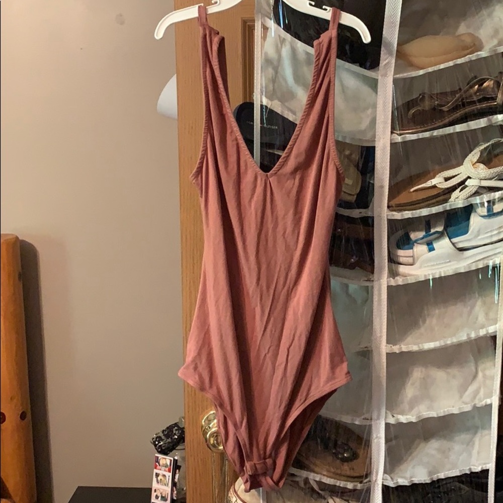 nude colored body suit